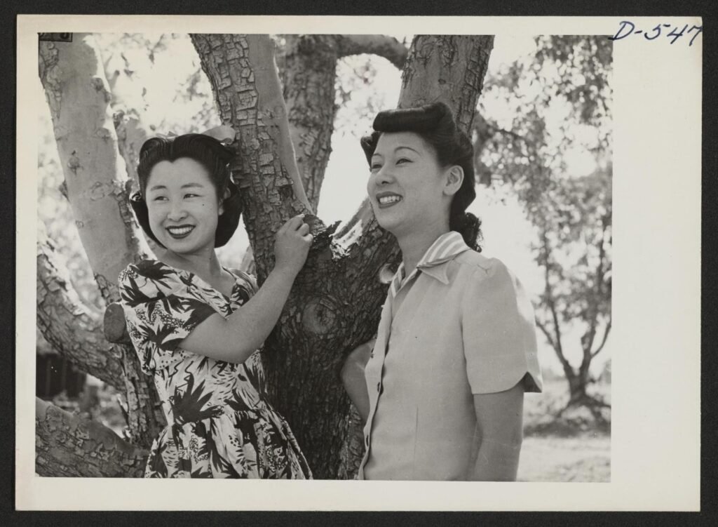 yamaguchi-and-hirashima-under-apple-tree-at-manzanar-1942